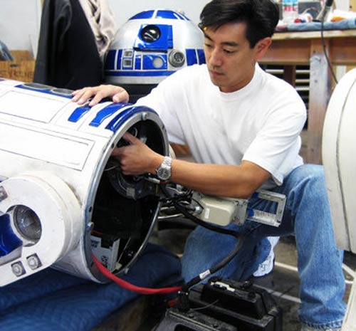 Grant Imahara working on R2-D2